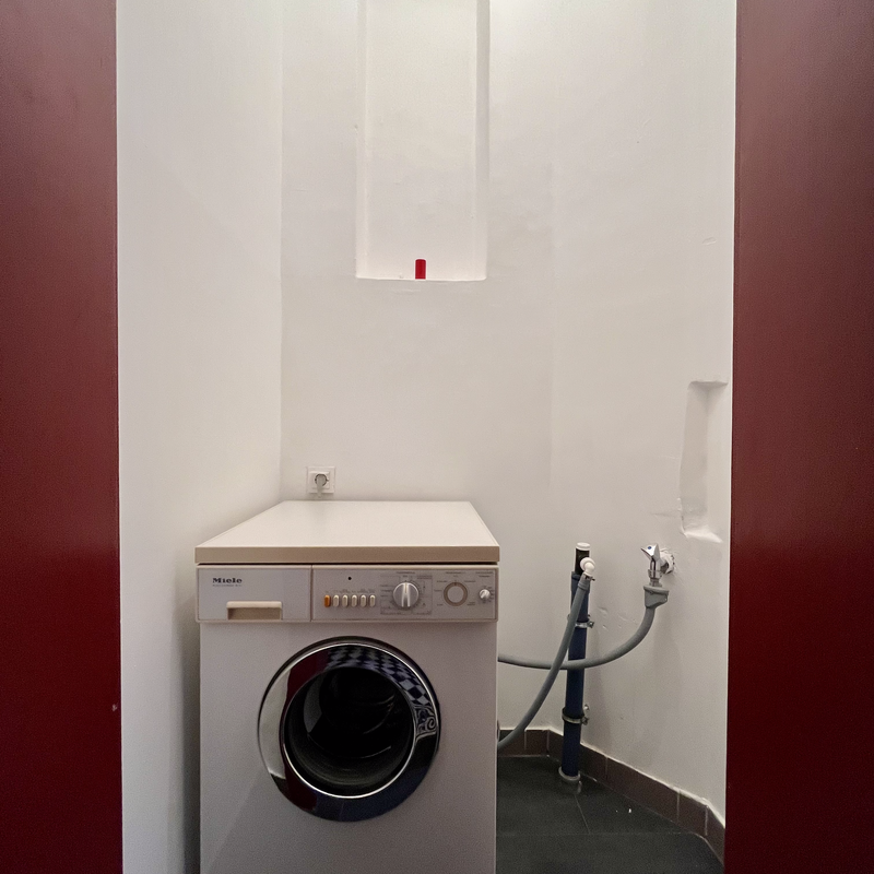 Extra room one level below with washing mashine