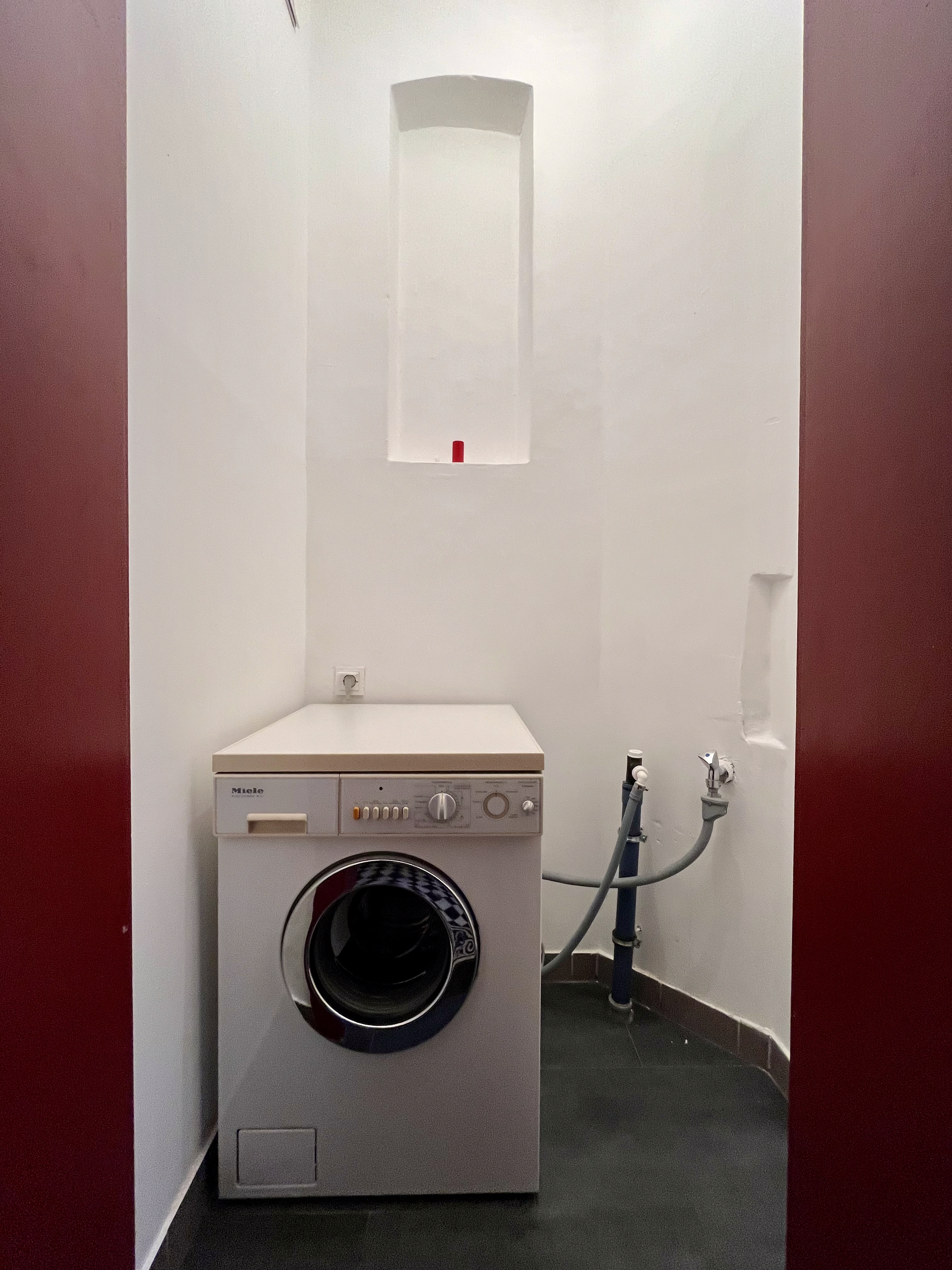 Extra room one level below with washing mashine