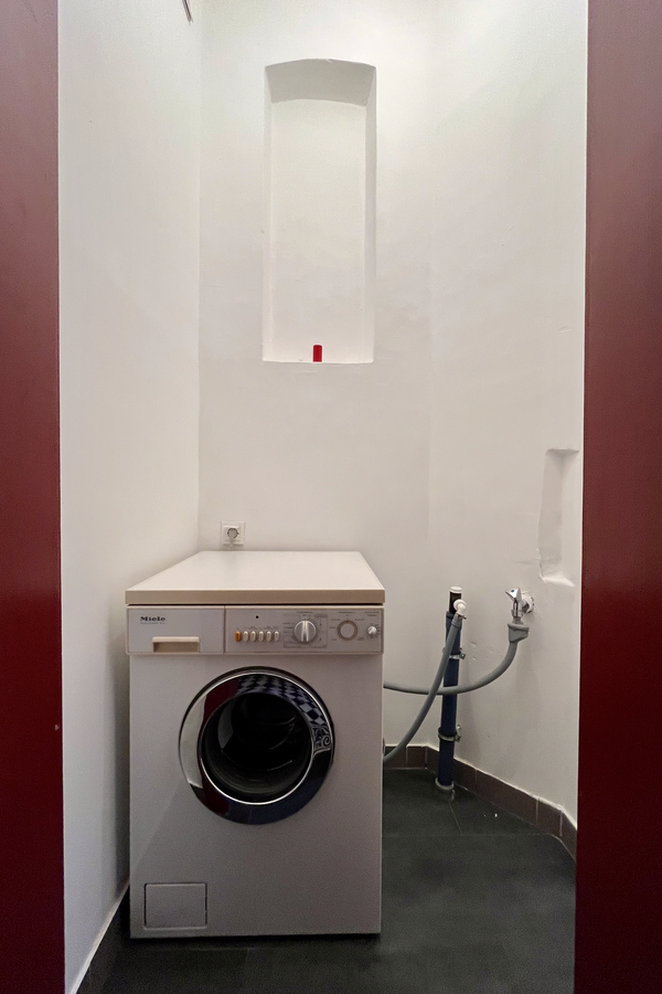 Extra room one level below with washing mashine