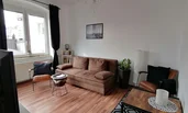 Cosy living room with pull-out sofa | © @wolfistraunseeblick
