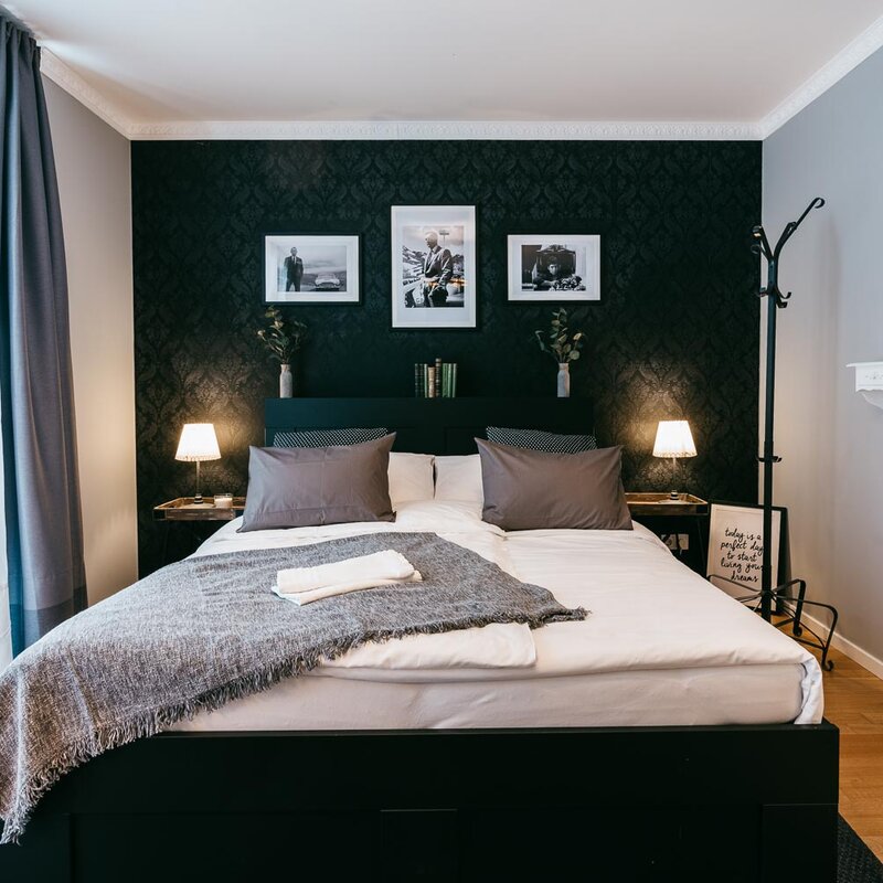 Stylish bedroom with double bed & design details – 2-room apartment for short-term rental & temporary housing for 1 to 6 months in Graz