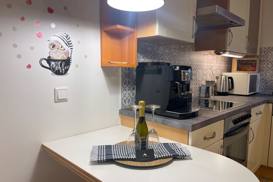 Fully equipped kitchen with fully automatic coffee machine