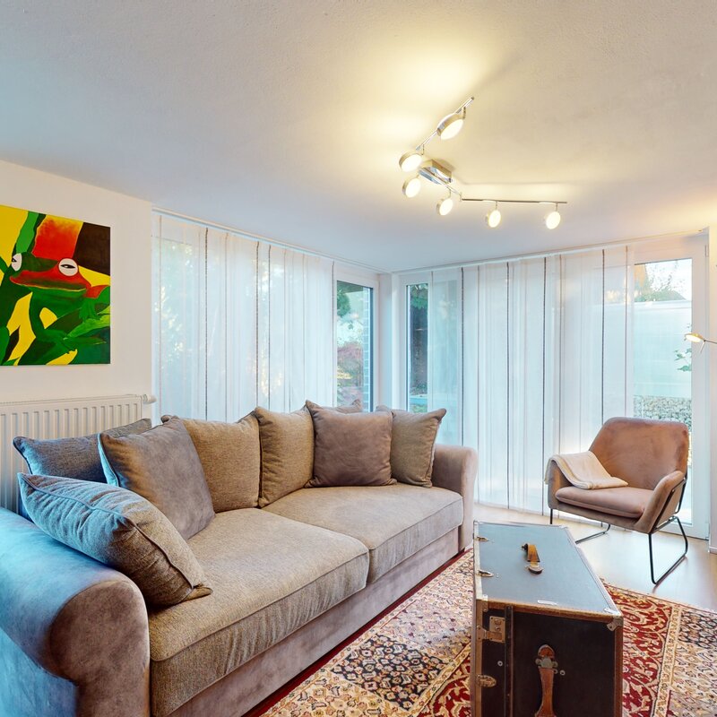 Bright living room with garden view – 3-room apartment, short-term rental & temporary housing for 1 to 6 months in Sattledt