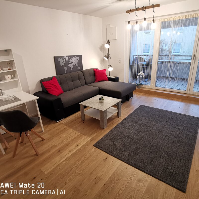 Bright living room with balcony – 2-room apartment for short-term rental & temporary housing for 1 to 6 months in Freilassing