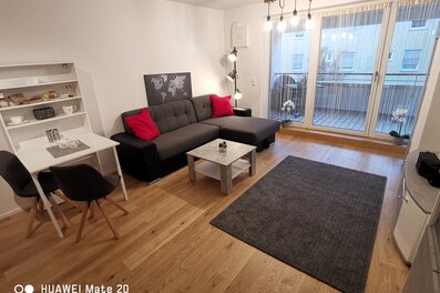 Bright living room with balcony – 2-room apartment for short-term rental & temporary housing for 1 to 6 months in Freilassing