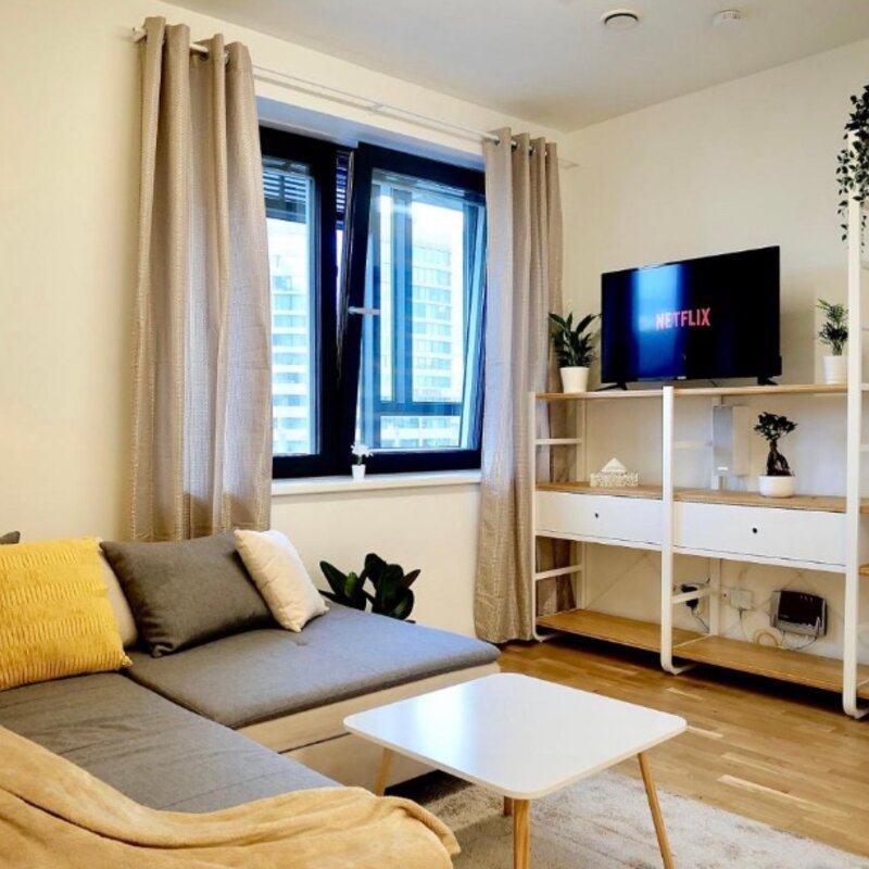 Wohnzimmer mit TV und Bettsofa | © Firmengruppe Abenthung
