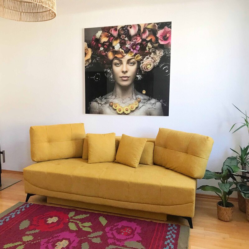 Bright living room with design sofa & art wall – 2-room apartment for short-term rental & temporary housing, 1 to 6 months, Salzburg