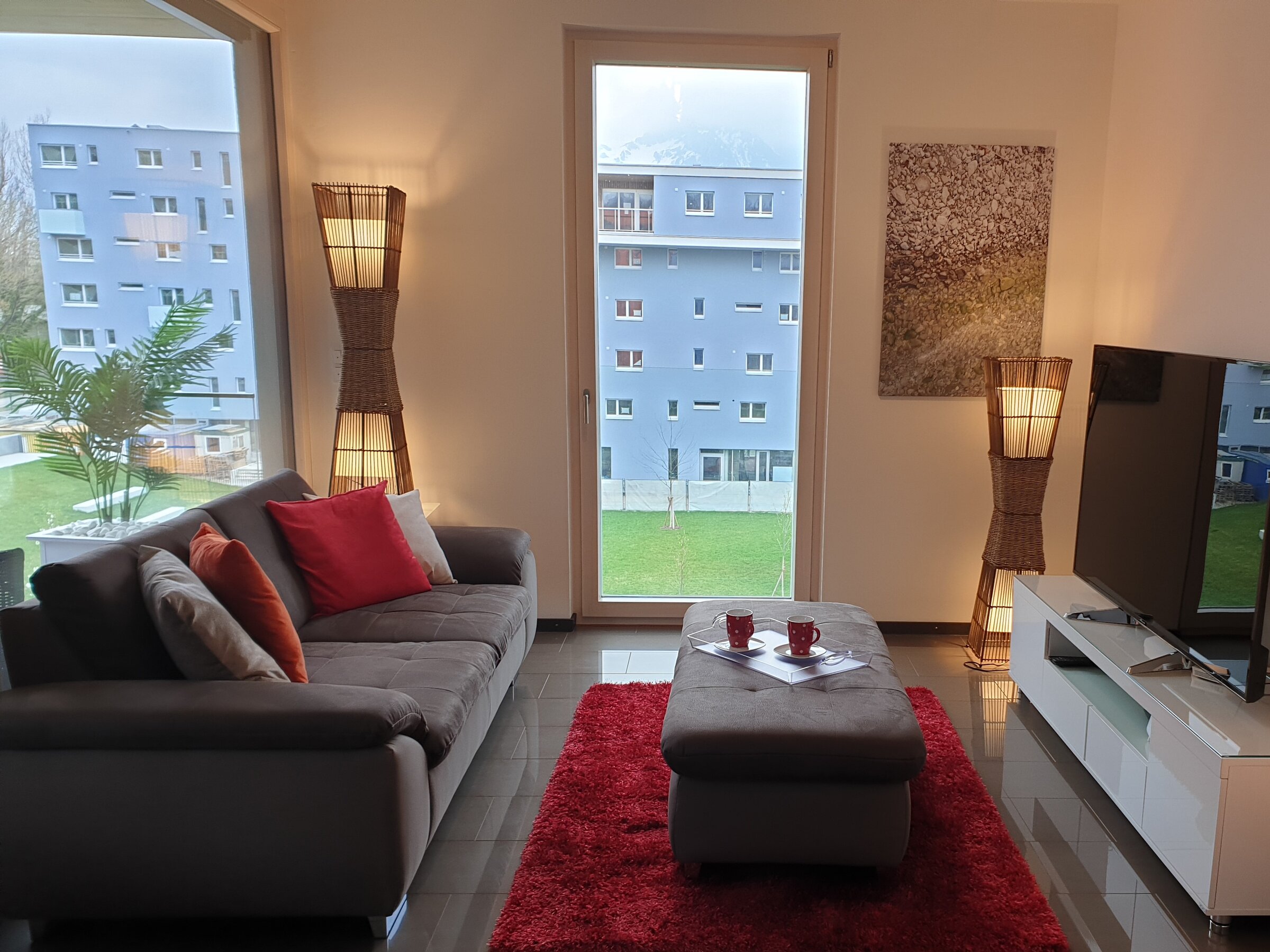 Bright living room with panoramic windows – 3-room apartment for short-term rental & temporary housing for 1 to 6 months in Salzburg