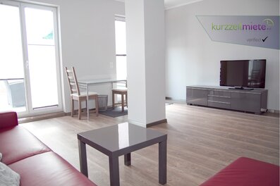 Bright living room with balcony – 1-room apartment for short-term rental & temporary housing for 1 to 6 months in Salzburg
