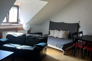 Bright living area with sloped ceiling, 2-room apartment for short-term rental – temporary housing for 1 to 6 months in Vienna