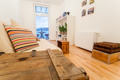Bright living room with balcony – 2-room apartment for short-term rental & temporary housing for 1 to 6 months in Graz