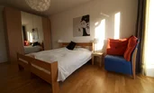 Bedroom with big double bed and large wardrobe
