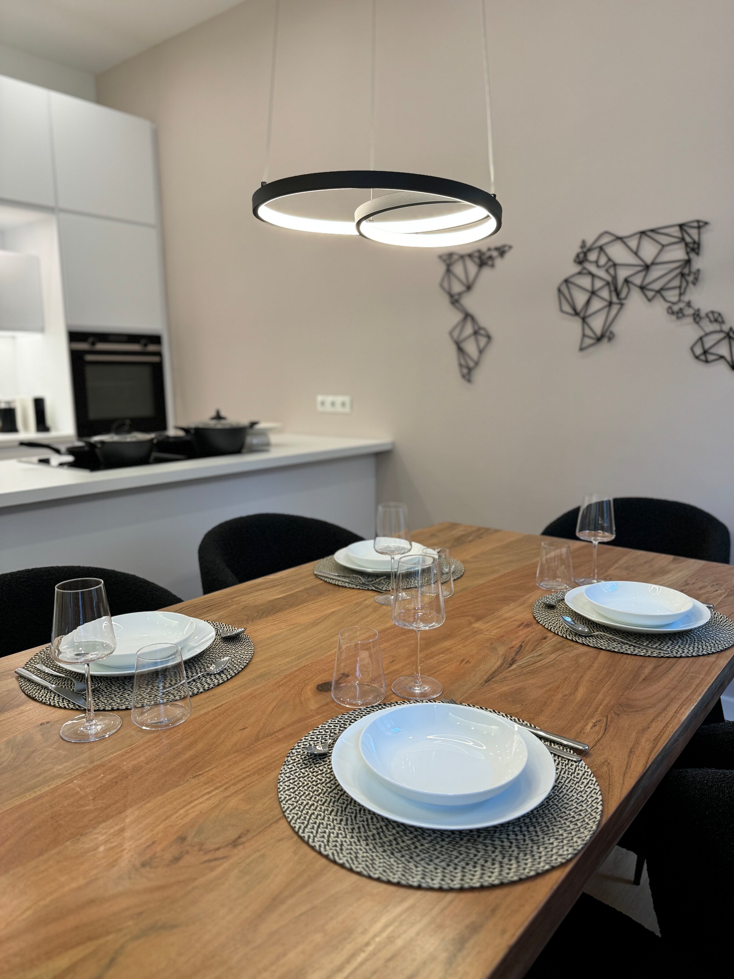 The stylish dining area seats four people and is perfect for shared meals and convivial evenings.