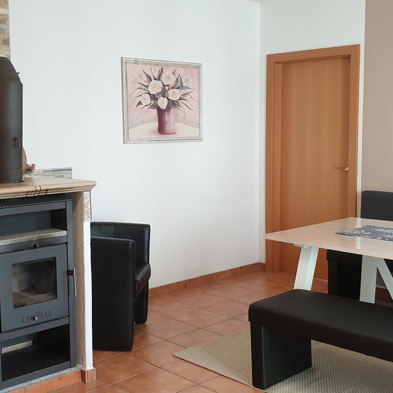 Dining, TV, fireplace, armchair