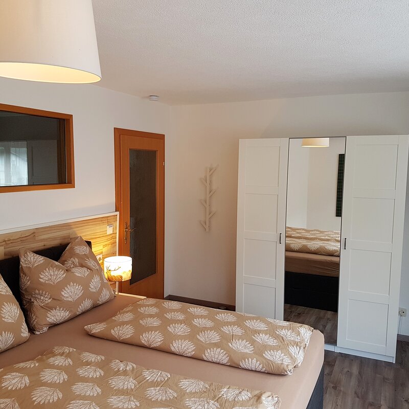 Box spring bed, wardrobe, TV