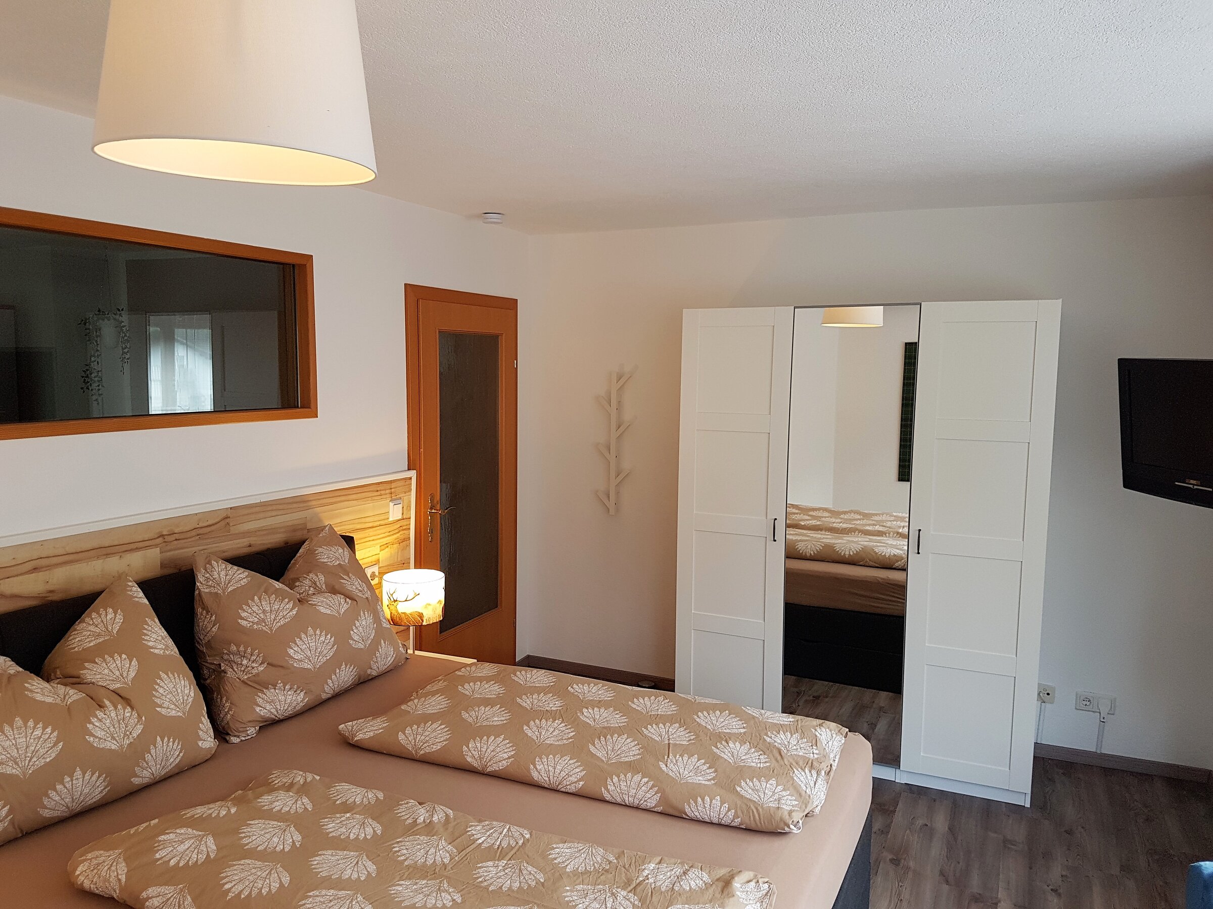 Box spring bed, wardrobe, TV