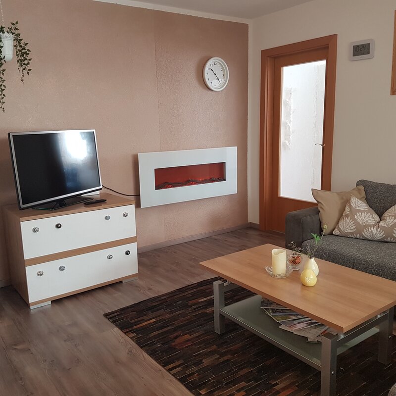 Couch, TV, fireplace, armchair