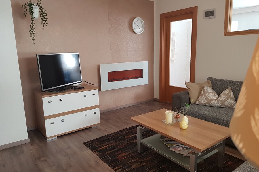 Couch, TV, fireplace, armchair