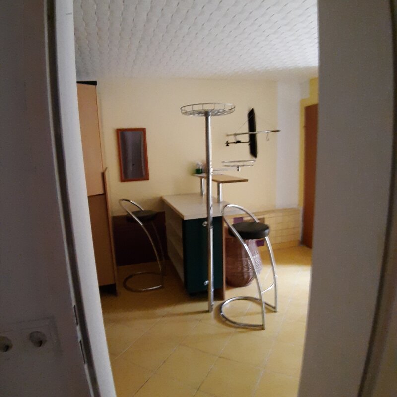 Between kitchen and living room