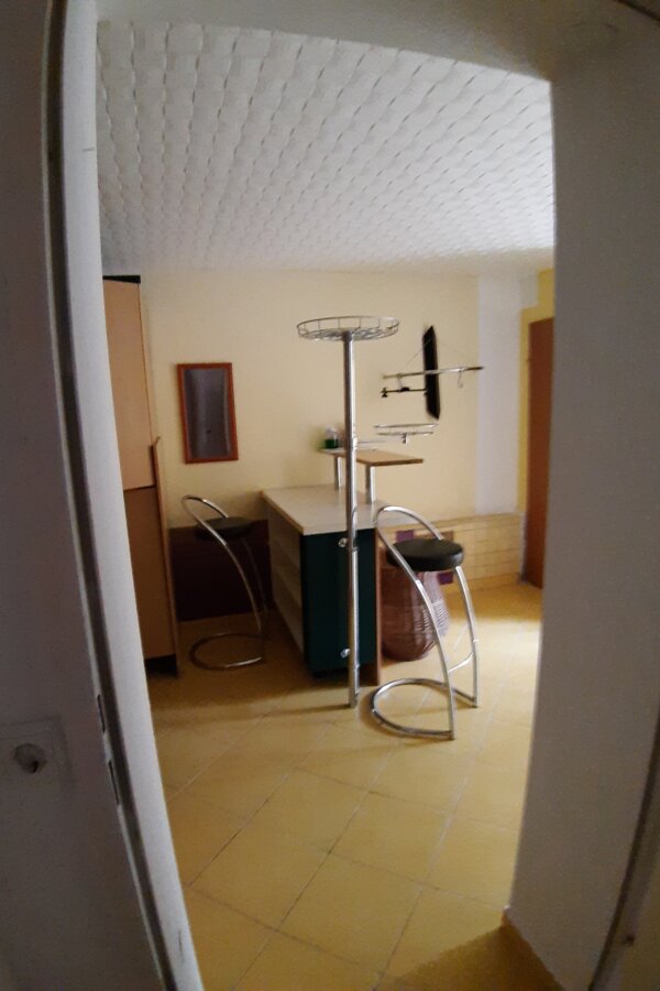 Between kitchen and living room