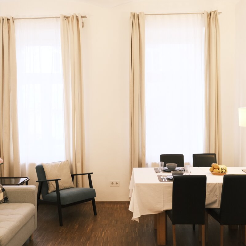 Bright living-dining area of a 2-room apartment for short-term rental – temporary housing for 1 to 6 months in Vienna