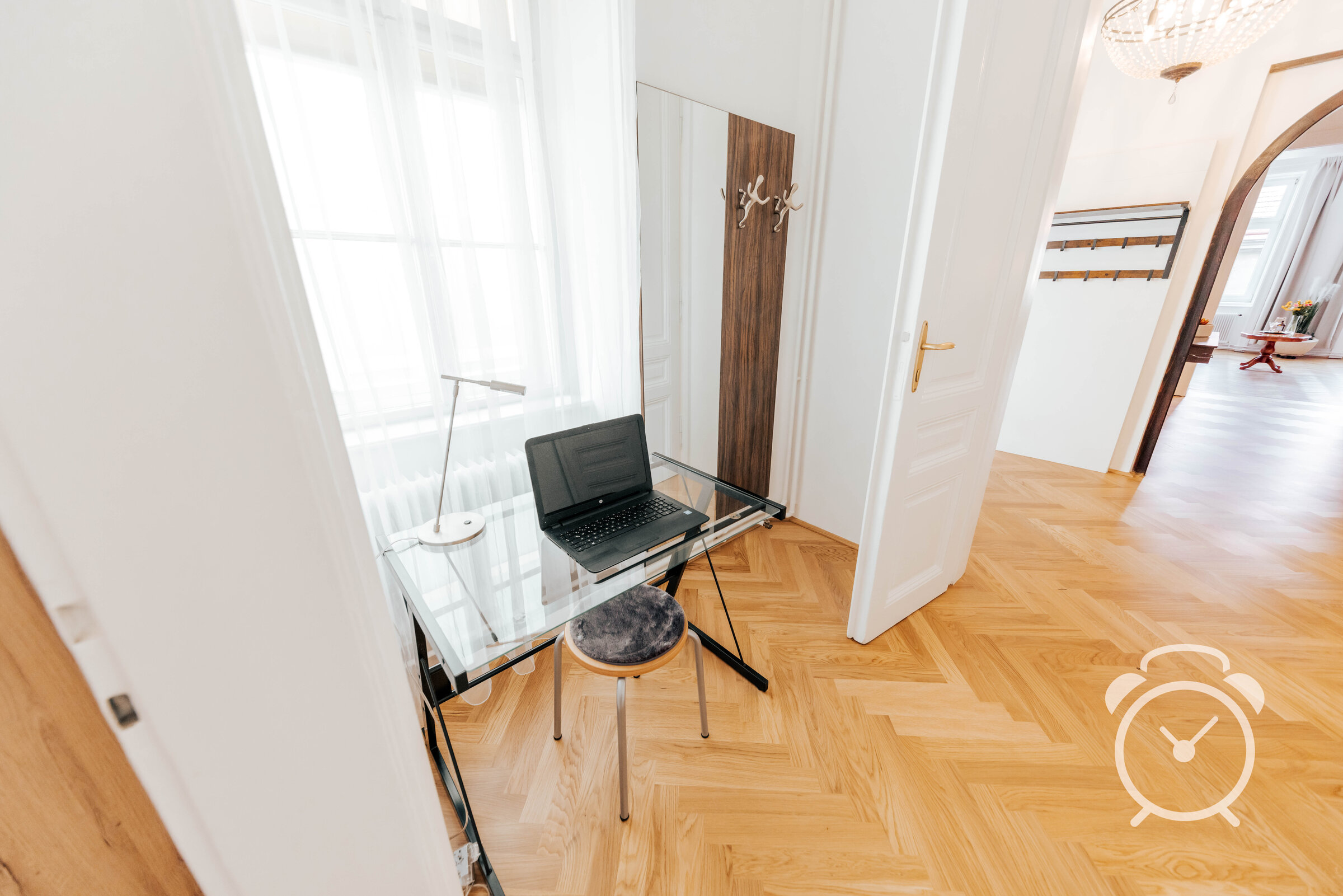 Bright workspace with glass desk & laptop – 3-room apartment for short-term rental & temporary housing for 1 to 6 months in Vienna