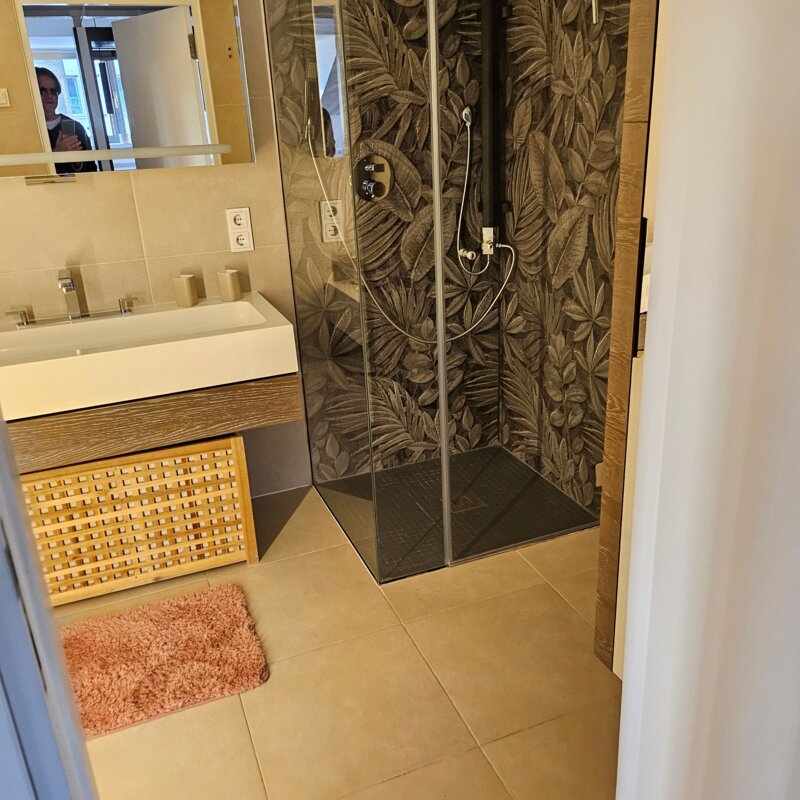Bathroom with shower and bathtub