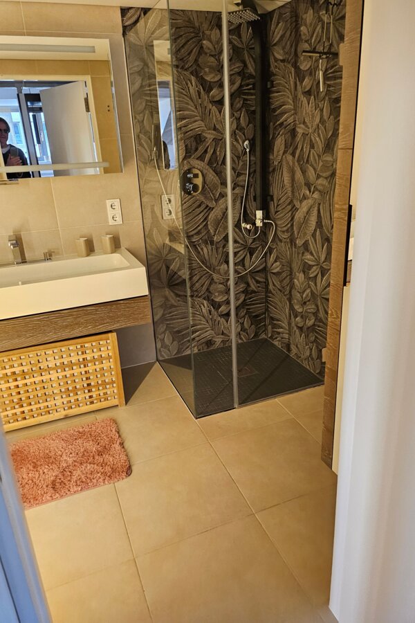 Bathroom with shower and bathtub