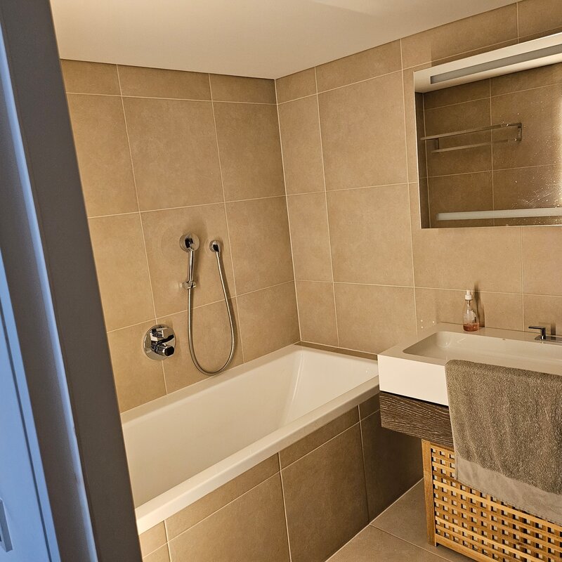 Bathroom with tub and shower