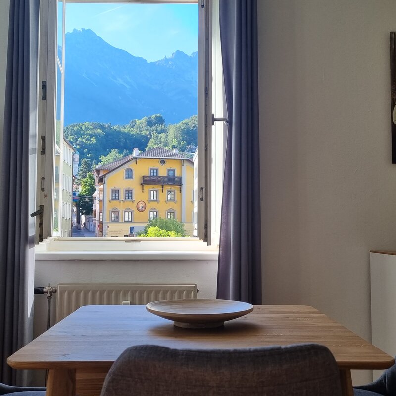Bright dining area with mountain panorama: 2-room apartment for short-term rental & temporary housing for 1 to 6 months in Innsbruck