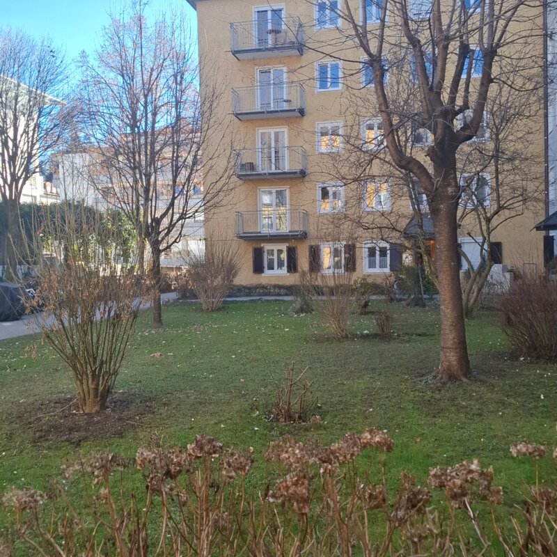 General garden and main entrance of building for apartment.