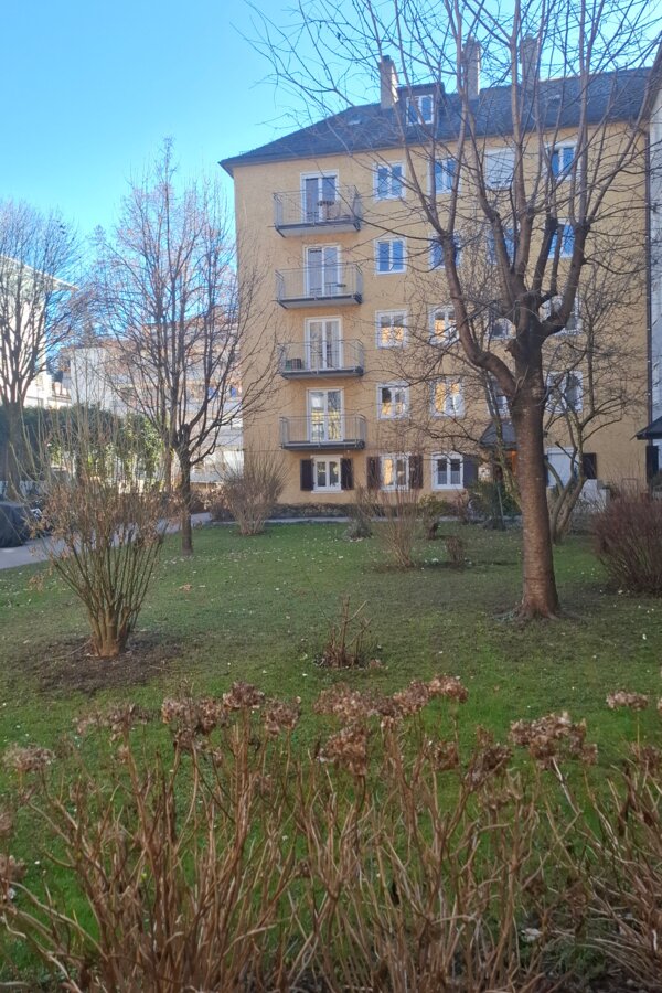 General garden and main entrance of building for apartment.