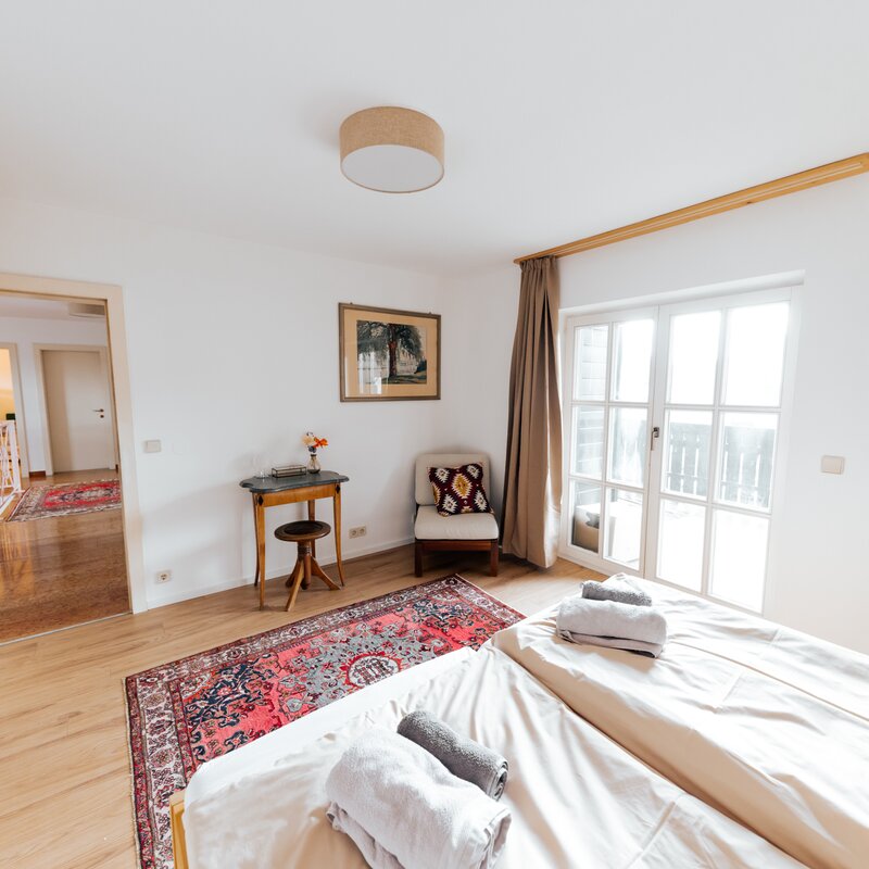 Bedroom with chill area and access to balcony with stunning Mountain View