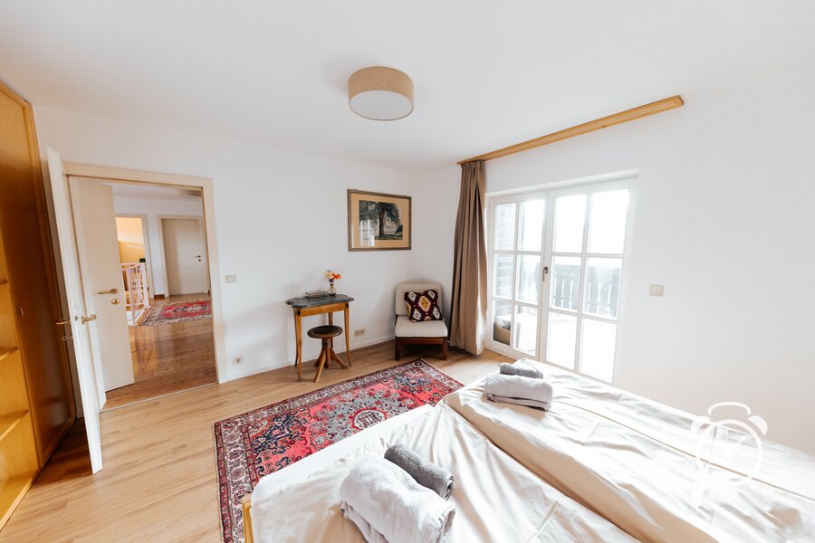 Bedroom with chill area and access to balcony with stunning Mountain View
