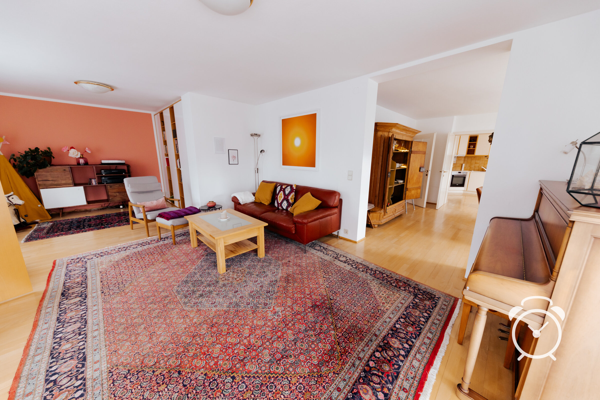living room with sofa, playing area for kids and sound system