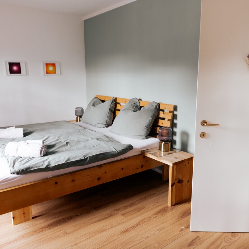 bright, big bedroom with wooden (pine) double bed with beautiful  Mountain View and access to spacious balcony