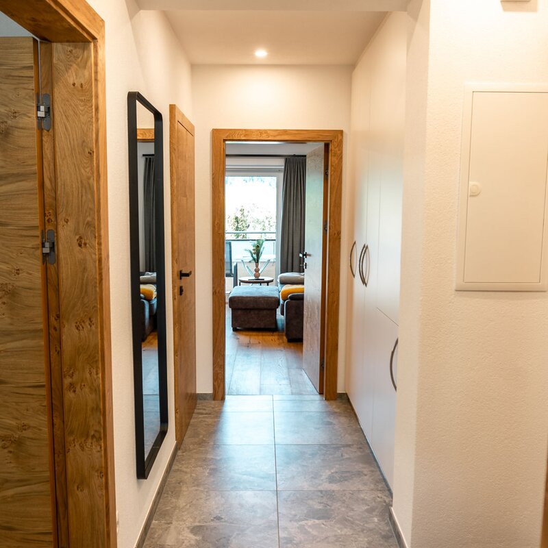 Entrance corridor with cloakroom and spacious storage cupboard 