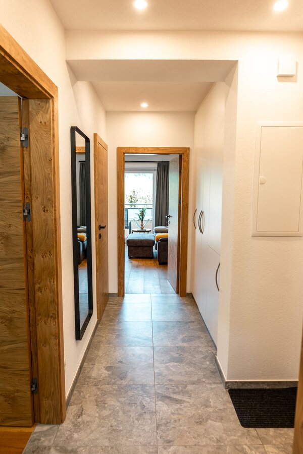 Entrance corridor with cloakroom and spacious storage cupboard 
