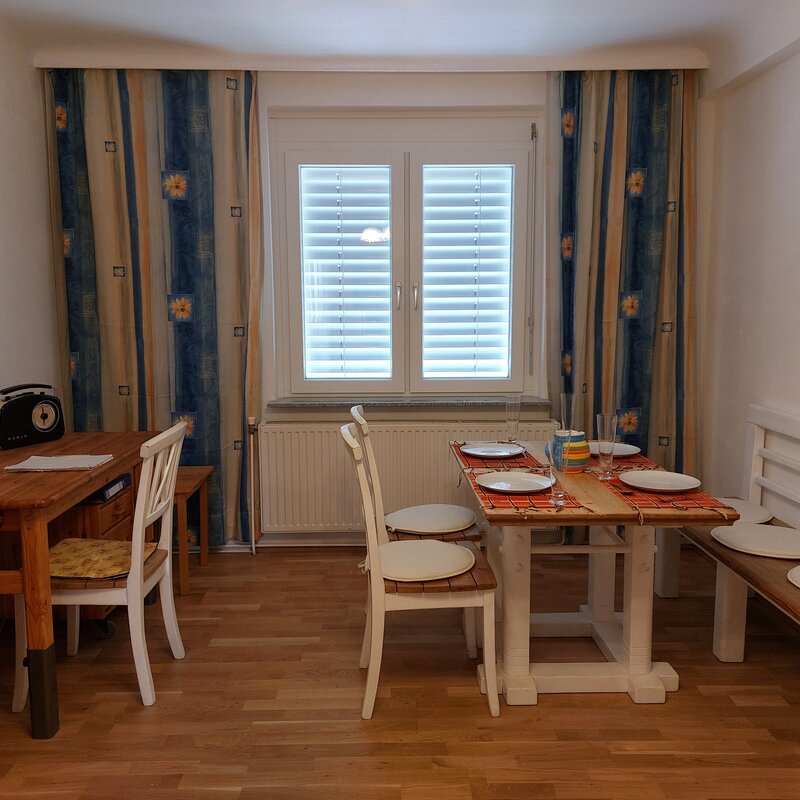 Living room with dining table and desk