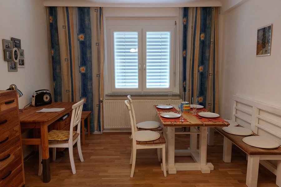 Living room with dining table and desk