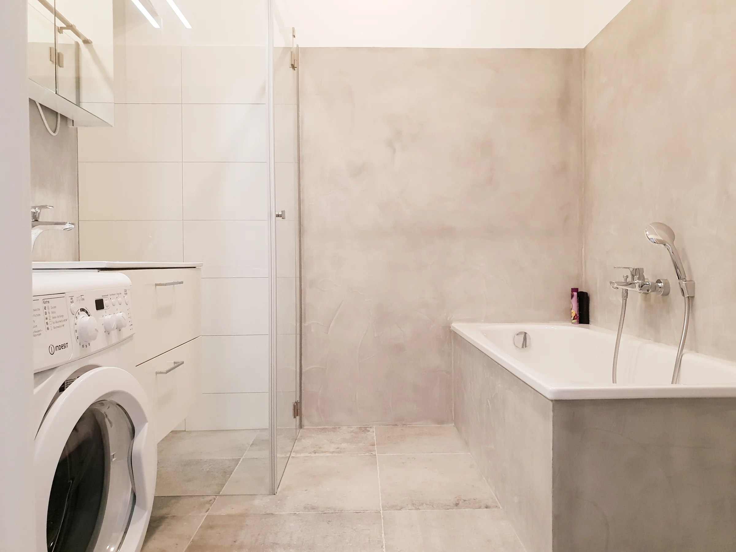 Bath with shower and bathtop