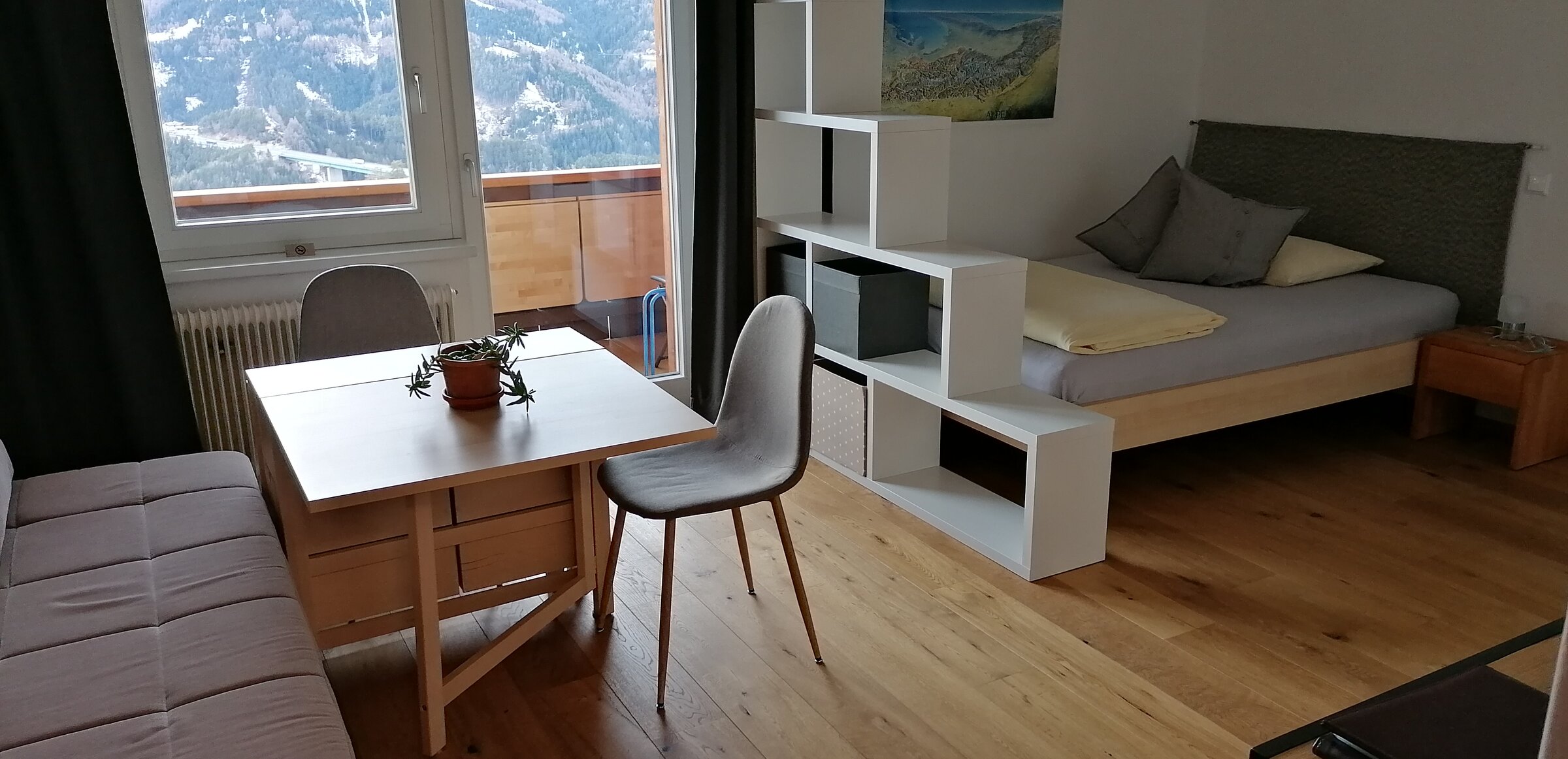 comfortable living- bedroom and balcony with panoramic view