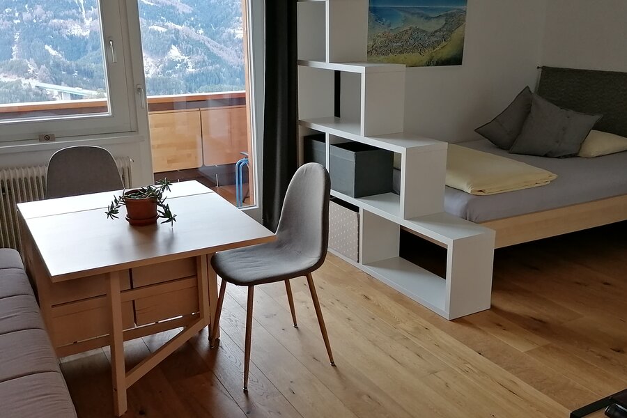 comfortable living- bedroom and balcony with panoramic view