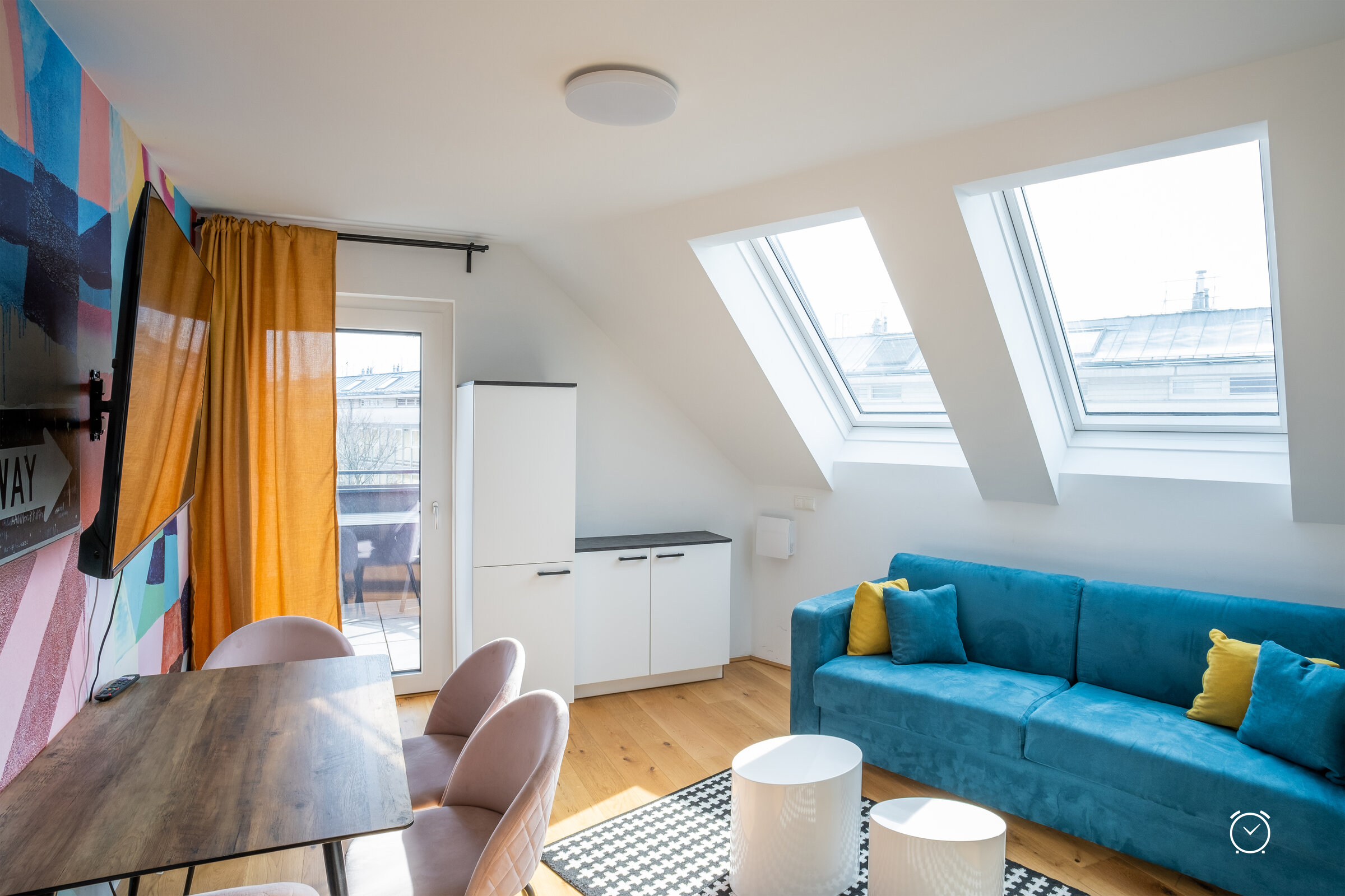 Bright 2-room apartment with skylights & blue sofa – short-term rental & temporary housing for 1 to 6 months in Vienna