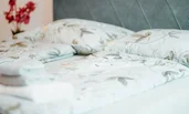 Large double bed, equipped with cotton bedding in cheerful colors, for a comfortable sleep. | © All rights reserved