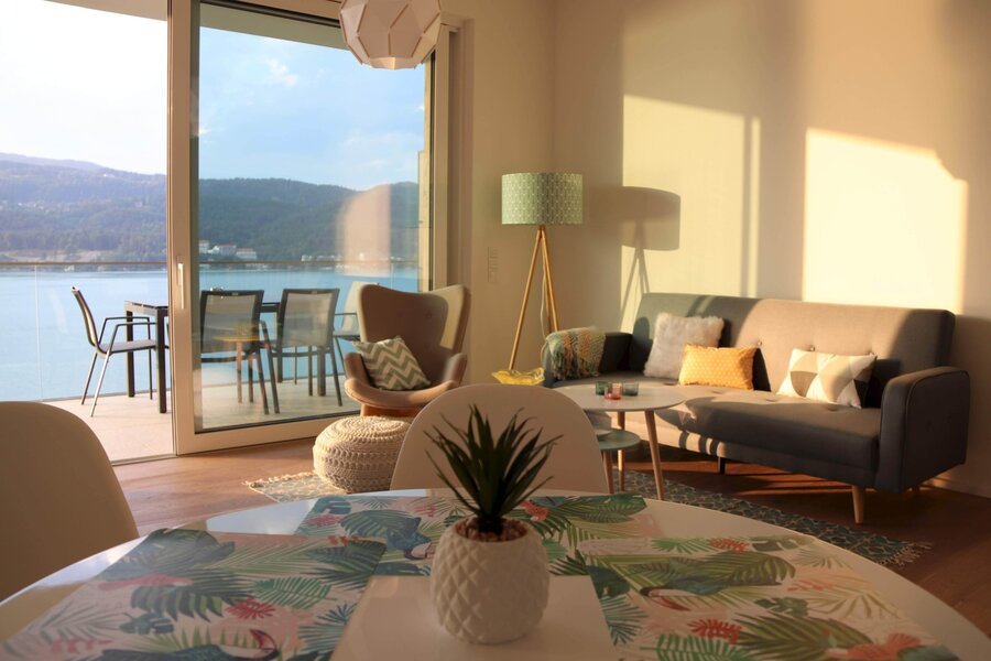 Bright living room with lake view: 2-room apartment for short-term rental & temporary housing for 1 to 6 months in Maria Wörth