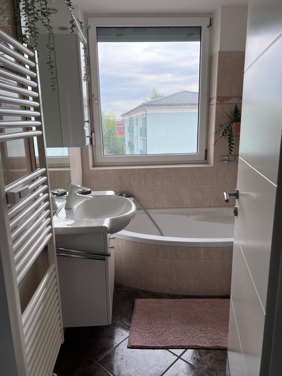 The bathroom with large window