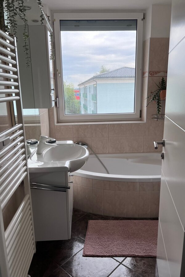 The bathroom with large window