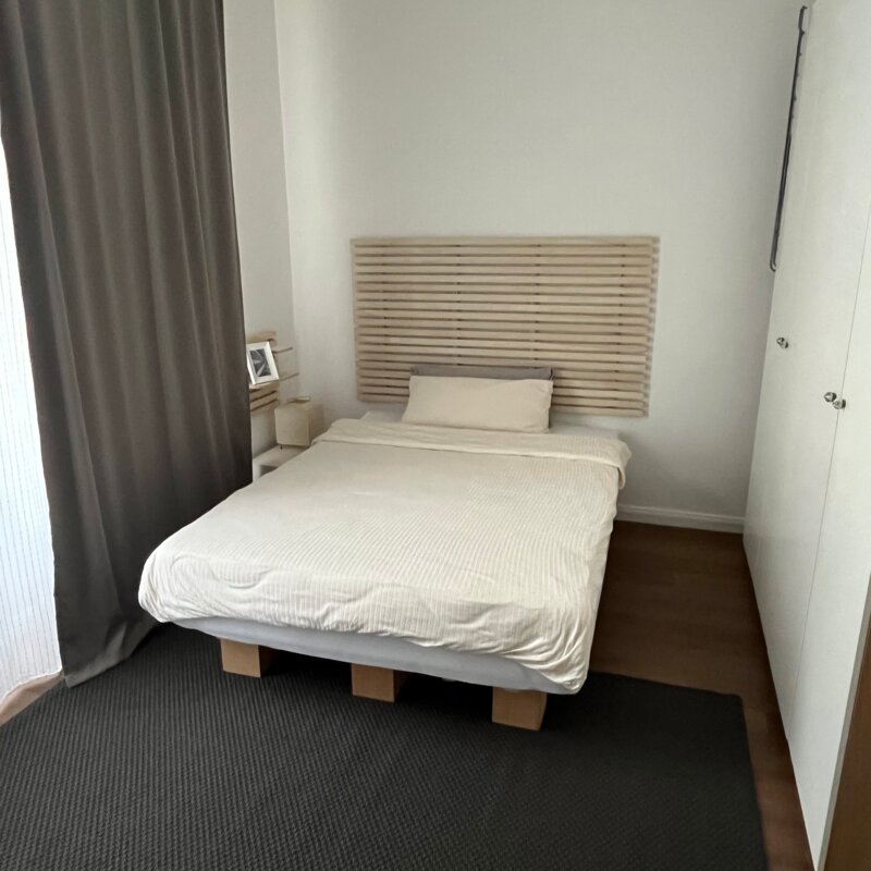 Bed with black-out curtain