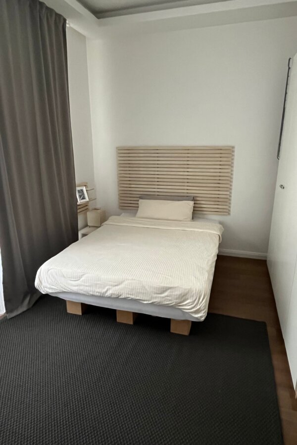 Bed with black-out curtain